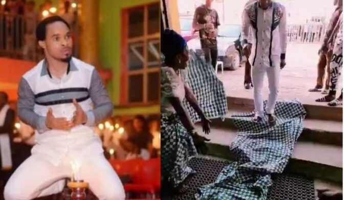 Moments Prophet Odumeje walks majestically as church women lay wrappers on the ground for him (Video)