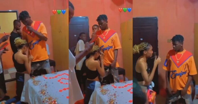 Nigerian set up Surprise to apologize to her boyfriend while kneeling before him (Video)