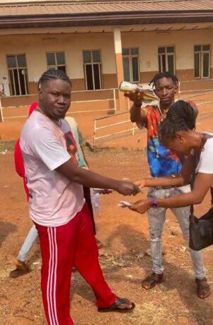 Nigerian big boy sprays course mate who always helped with his assignment as they sign out from school (Video)