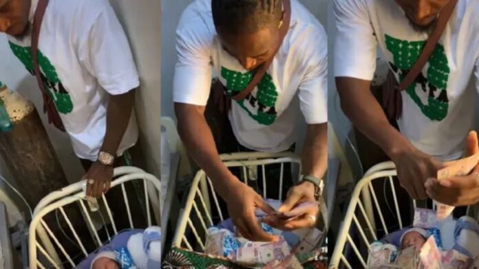 “This is senseless and unhealthy” – New dad comes under fire for spraying his newborn with naira notes (video)